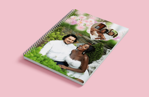 a spiral bound notebook with a couple of people