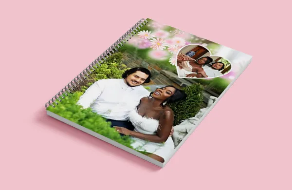 a spiral bound notebook with a couple of people