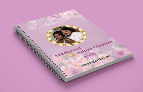 a spiral bound notebook with a couple of people