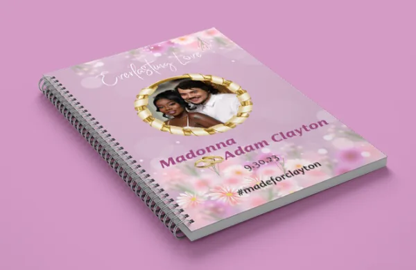a spiral bound notebook with a couple of people